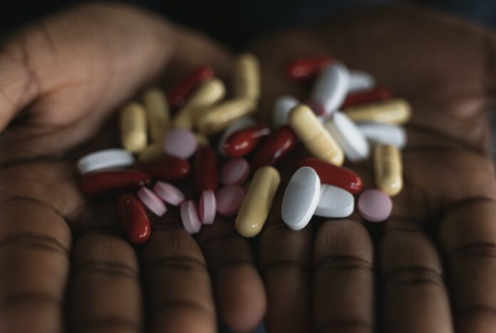 assorted pills in close up photography