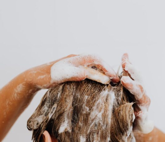 Anti-Dandruff Shampoos May Help Slow Male Pattern or Female Pattern Hair Loss woman washing her hair