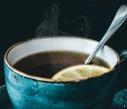 Is Tea Good for Headaches? Which Types to Drink (and Avoid) When Your Head Hurts photography of blue ceramic coffee cup