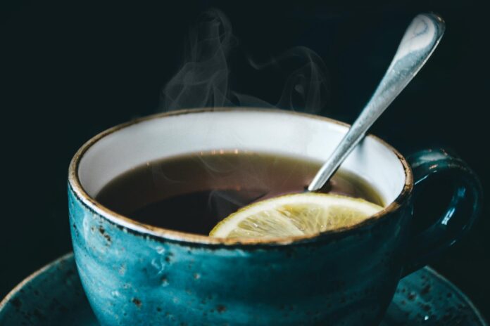 photography of blue ceramic coffee cup